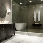 Black and white bathroom with separate shower area