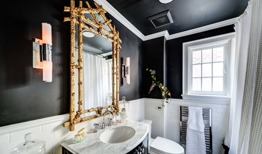 Black and white bathroom with a golden accent