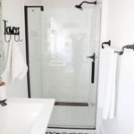 Small white bathroom with floor patterns