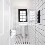 White bathroom in narrow space.