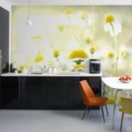 Wall mural in the interior of the kitchen in a black and white palette combined with upholstery