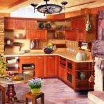 Kitchen design in a private house with a rustic fireplace