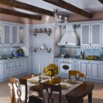 Design of a kitchen in a private house Provence style with a corner arrangement