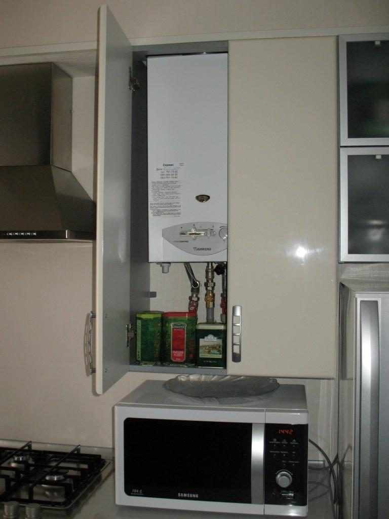 An example of a light kitchen decor with a gas boiler