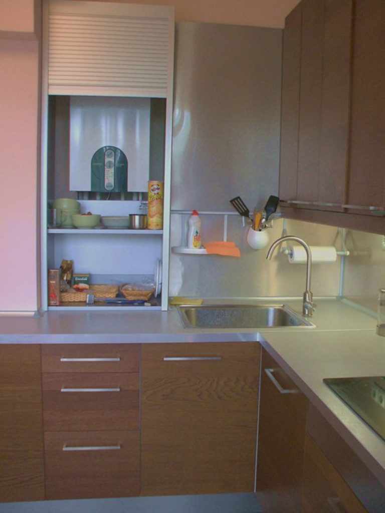 an example of an unusual style of kitchen with a gas boiler