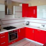 An example of a bright style of red kitchen photo