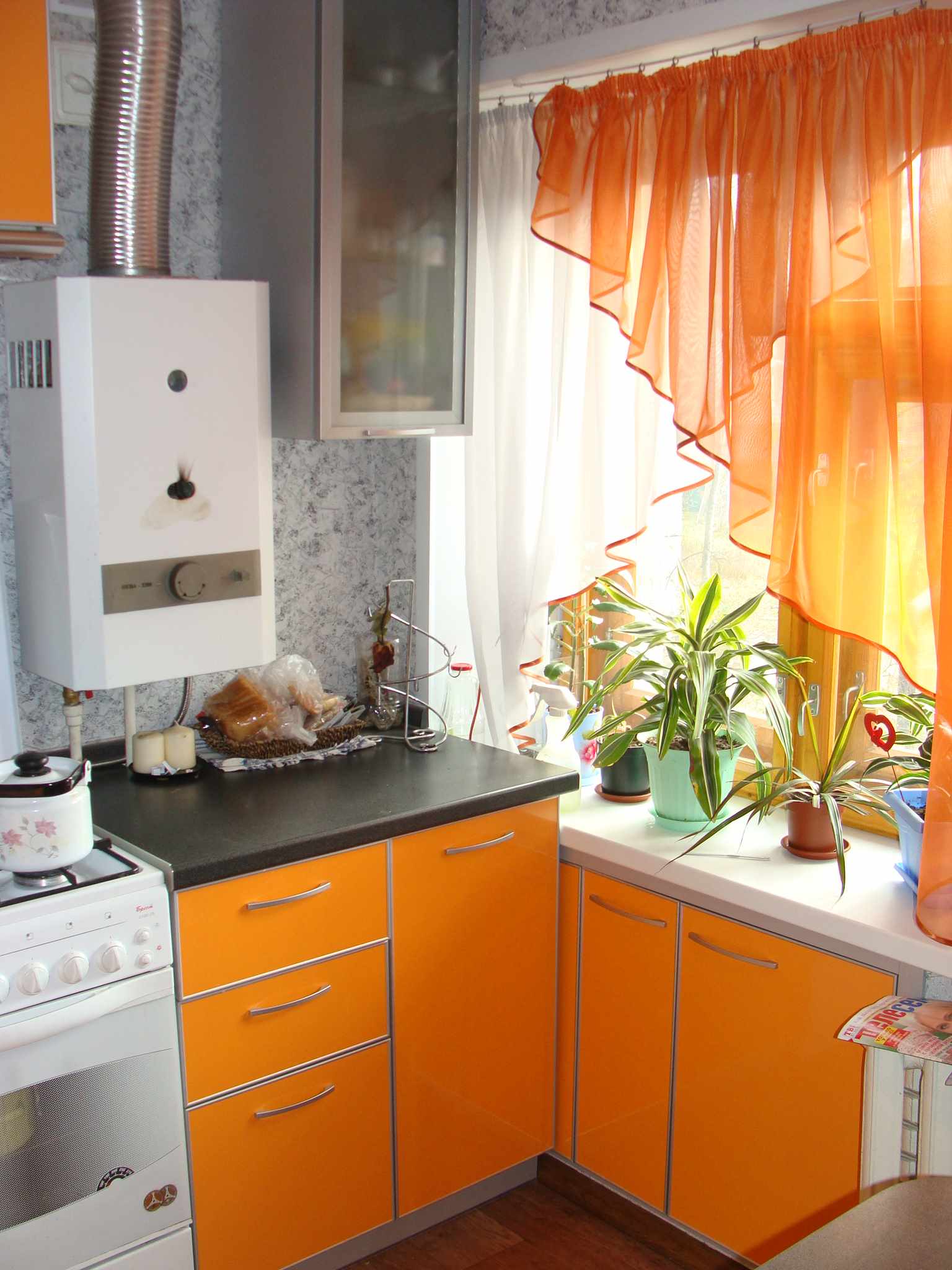An example of a beautiful kitchen interior with a gas boiler
