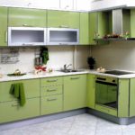 An example of a bright style of a corner kitchen picture
