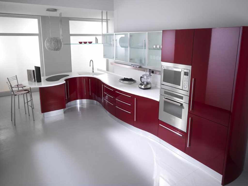 An example of a bright interior of a red kitchen