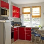 Kitchen with glossy red facades