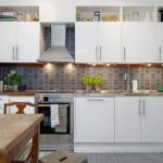 Highlighting the work area of ​​a linear kitchen set