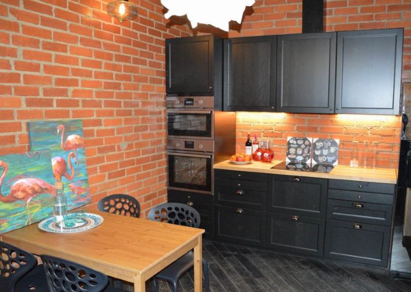 Kitchen design with red brick wall decoration