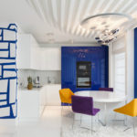 The combination of blue and yellow in a white kitchen