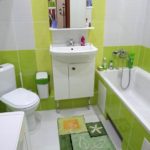 Lime tiles in the combined bathroom