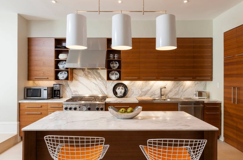 Chandelier with large lights over the kitchen island