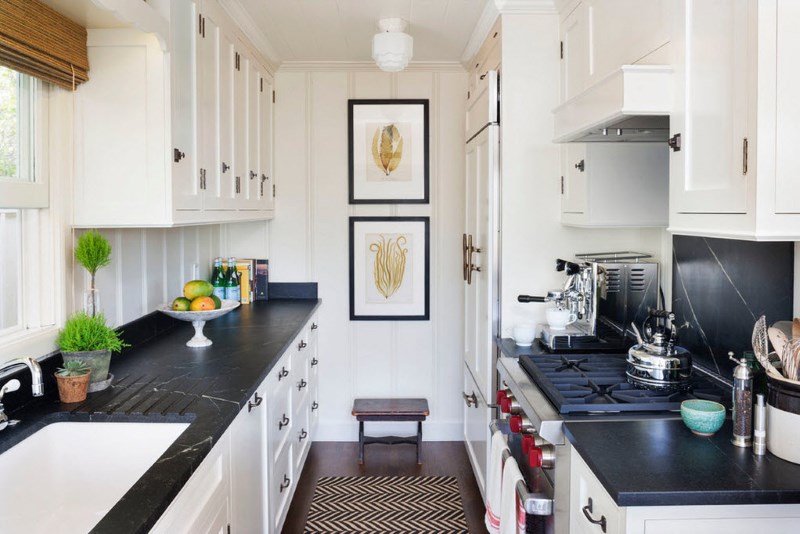 Black countertops kitchen unit with white cabinets