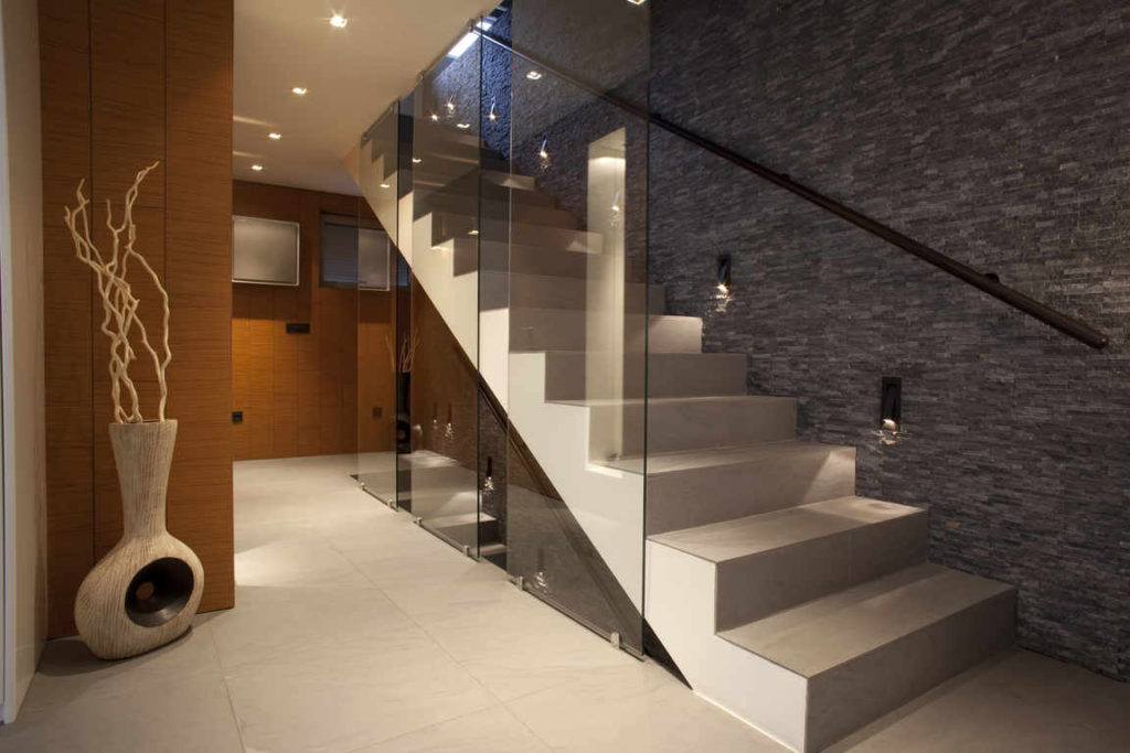 Concrete staircase with durable glass railing