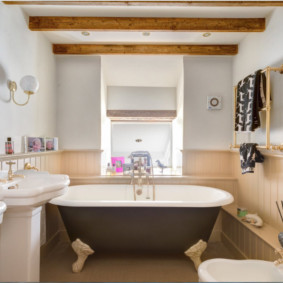 Wooden beams on the ceiling of the bathroom