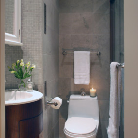 White toilet in a gray room