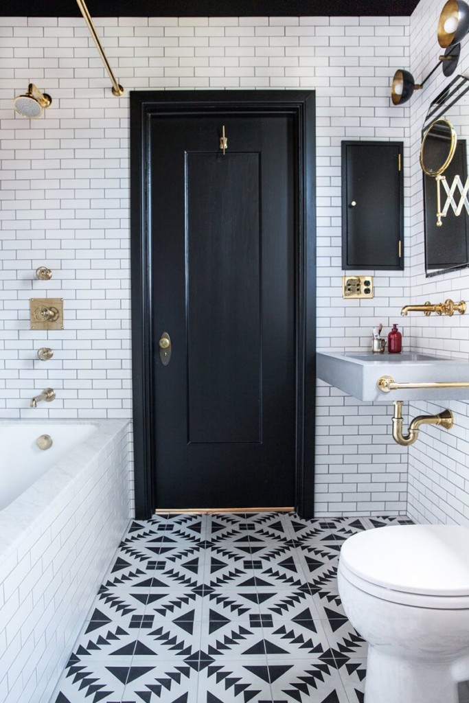 Mosaic bathroom floor made of black and white tiles