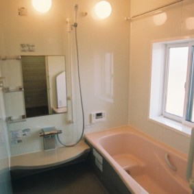 Small bathroom with a window in the wall