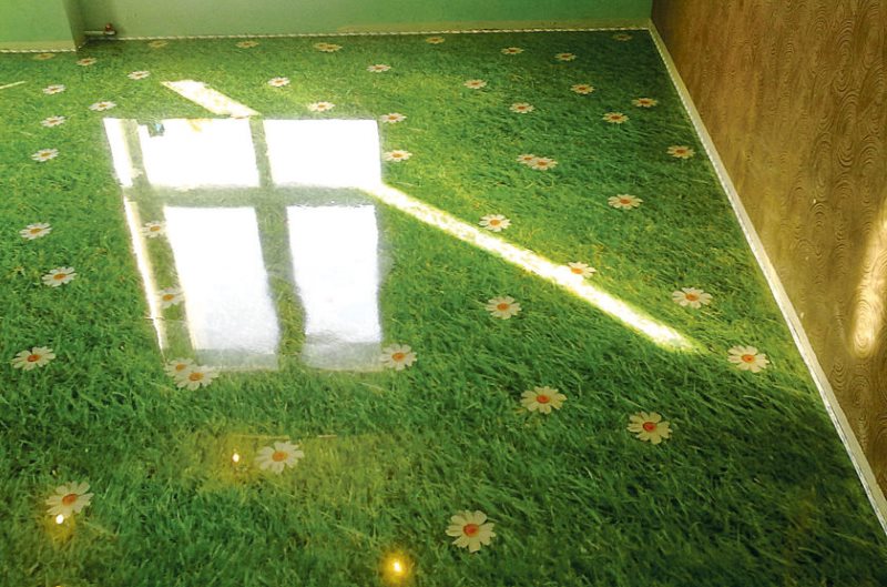 Plancher en vrac époxy avec une photo d'herbe