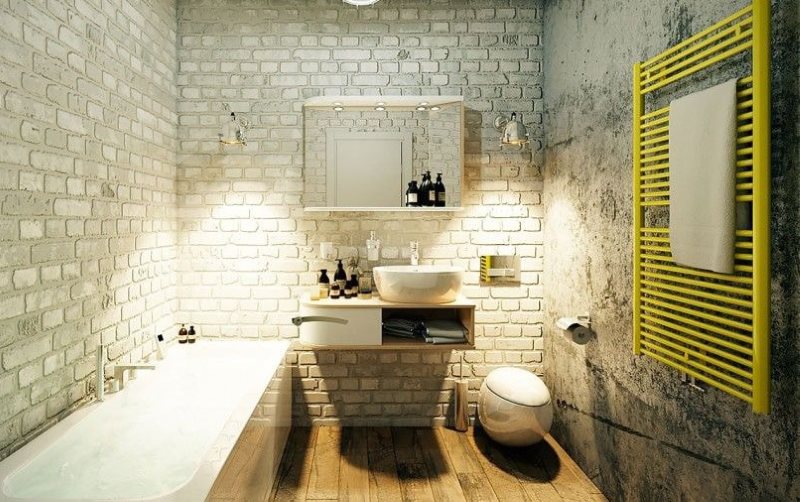 Porte-serviettes chauffant jaune dans une salle de bain de style loft