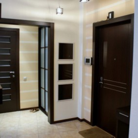 Black doors in the corridor of the apartment