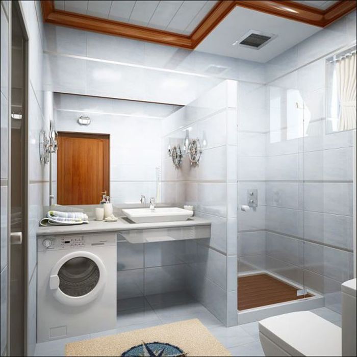 Cabine de douche dans la salle de bain avec machine à laver