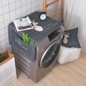 Cape avec poches pour une machine à laver
