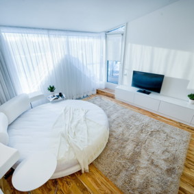 studio avec un lit et un canapé design photo