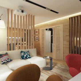 דירת סטודיו עם רעיונות לעיצוב מיטה וספה