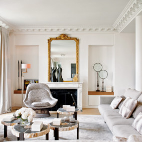 Large mirror above the fireplace in the living room