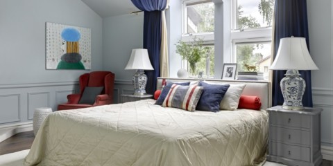 bedroom with a bed by the window photo design