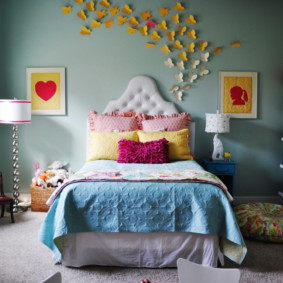 Colored paper butterflies on bedroom wall