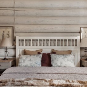 Decor of a bedroom in a wooden house