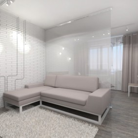 Glass partition behind the corner sofa