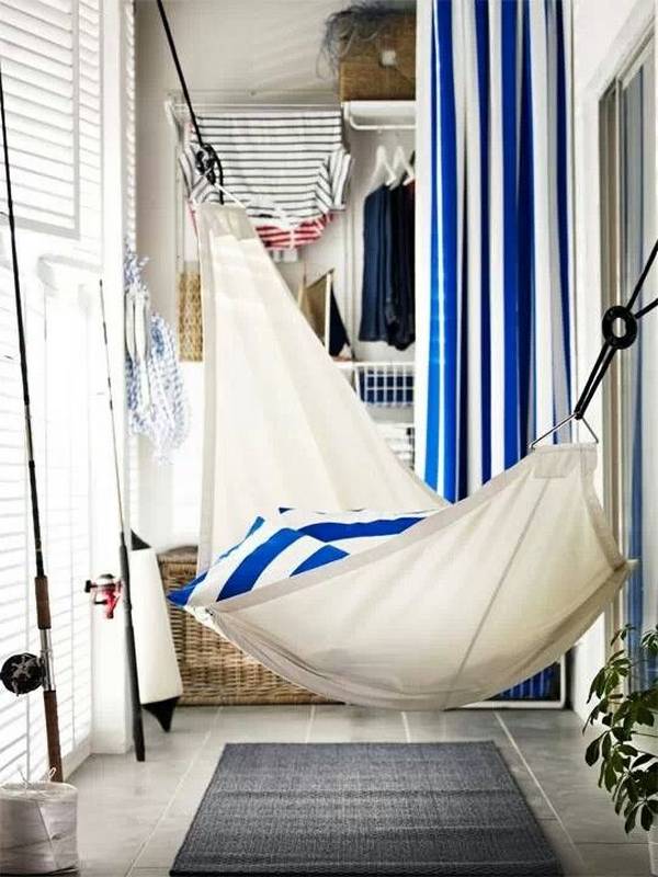 Hammock on a glassed balcony of a city apartment