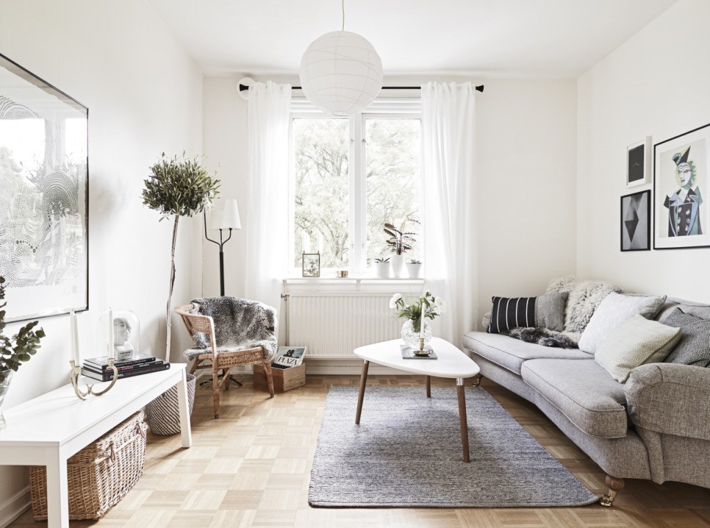 White curtains on the window of a scandinavian-style apartment