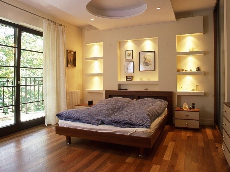 Niches with lighting in the bedroom interior