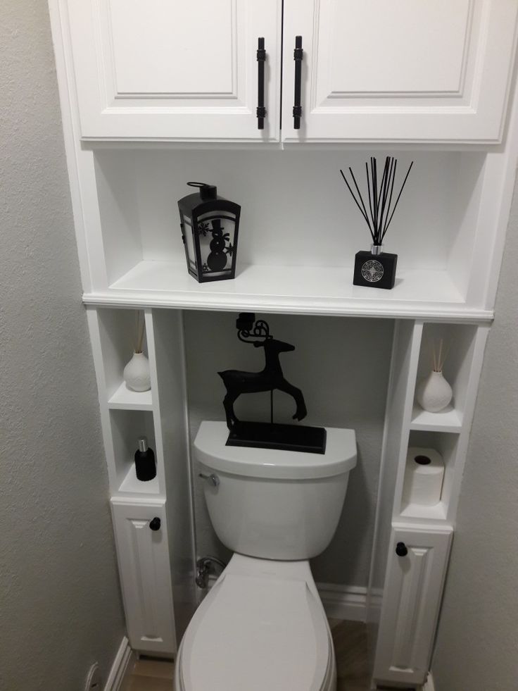 Shelves over the toilet in the toilet of a studio apartment