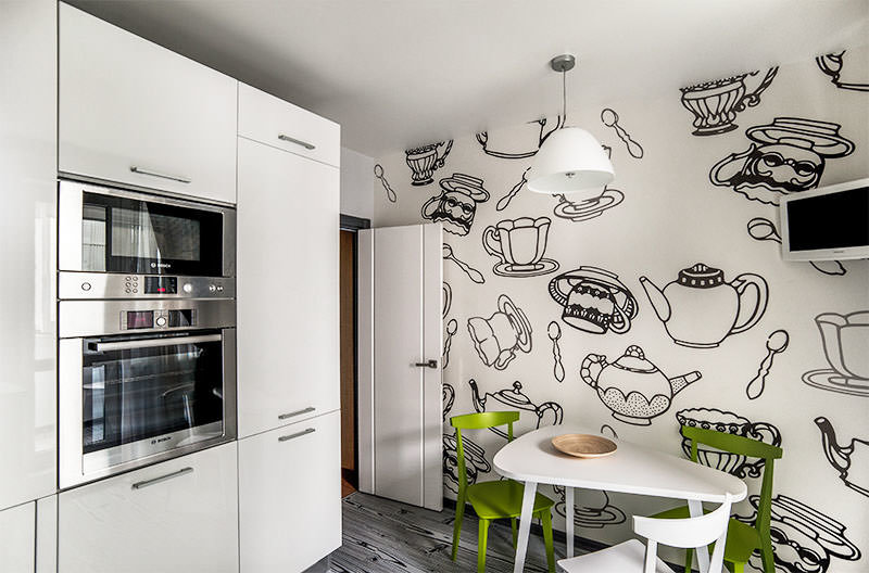 Black and white drawings of dishes on the kitchen wall