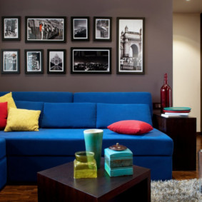 Bright pillows on a blue sofa