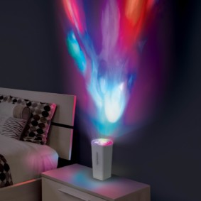 Projection night light on bedside table