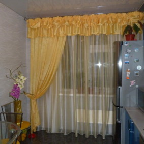 Yellow curtain on the kitchen window