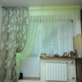 Plastic blinds on a window with a one-sided curtain