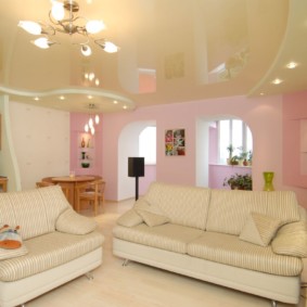 Bright furniture in the hall with stretch ceiling