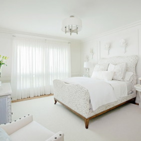 Snow-white interior of a modern bedroom