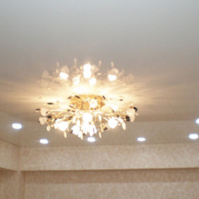 Rectangular arrangement of lamps on the ceiling of the living room