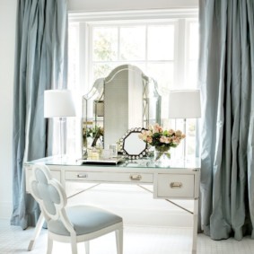 Dressing table by the window of a bright bedroom